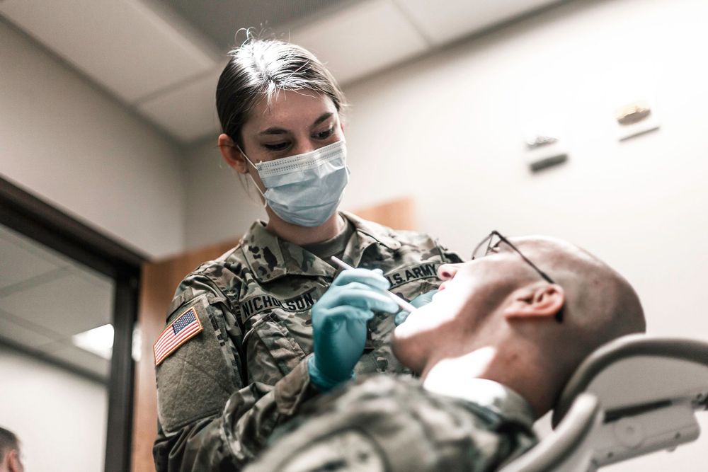 Army National Guard healthcare professional providing dental care